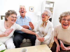 senior-man-and-women-playing-cards-at-home