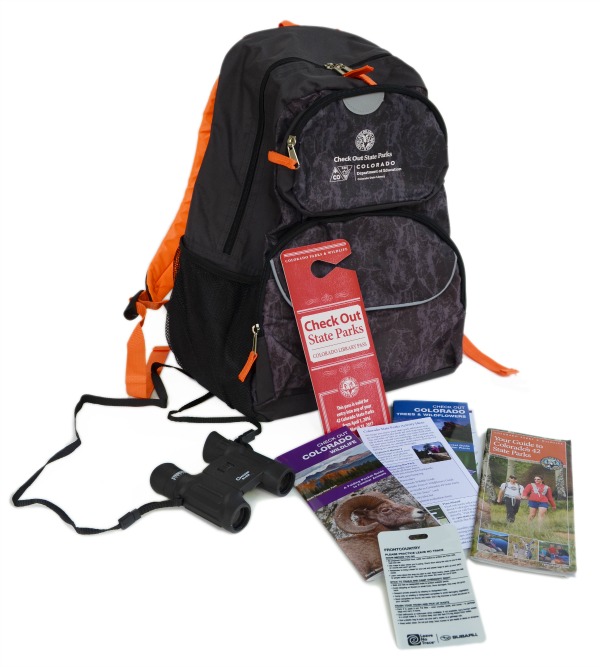 backpack with state parks pass, binoculars, and brochures.