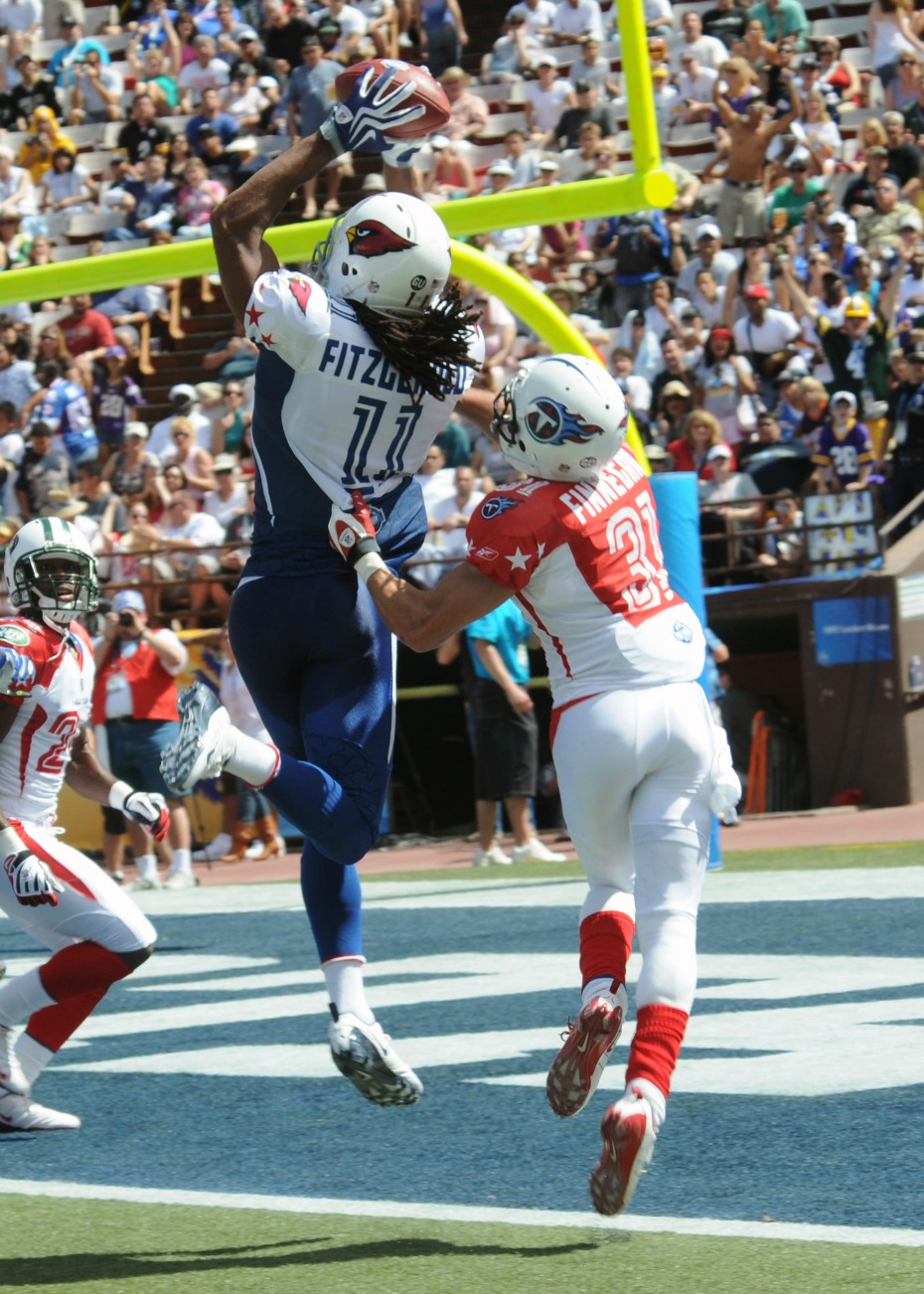 090208-N-9758L-854 HONOLULU, HI (Feb. 8, 2009) Arizona Cardinals wide receiver Larry Fitzgerald (#11) catches a touchdown pass from New Orleans Saints quarterback Drew Brees during the second quarter of the 2009 National Football League Pro Bowl. The annual event, which features all-star players from the NFC and AFC, has been held at Aloha Stadium for 30 consecutive years. The NFC defeated the AFC 42 to 30. (U.S. Navy photo by Mass Communication Specialist 2nd Class Michael A. Lantron/RELEASED)