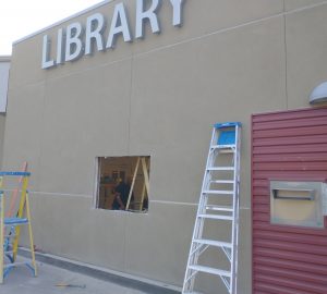 Hole cut in wall of Central Library for installation of drive-through window