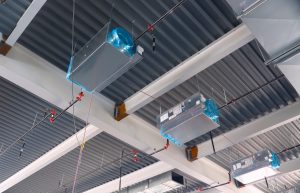 Water lines with ceiling sprinklers and metal air units are shown installed in the new Clifton Branch Library.
