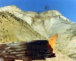 [Photo ID]: A rich chunk of oil shale achieves a self-sustaining burn at the Anvil Points Oil Shale Research Facility near Rifle, Colorado.