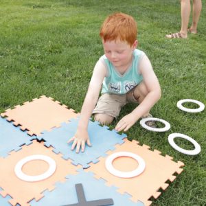 child playing tic tac toe game