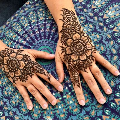 hands with henna tattoos