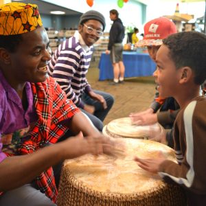 Adult and child drumming